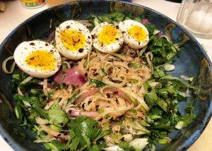 Pho with rice noodles and soft boiled eggs